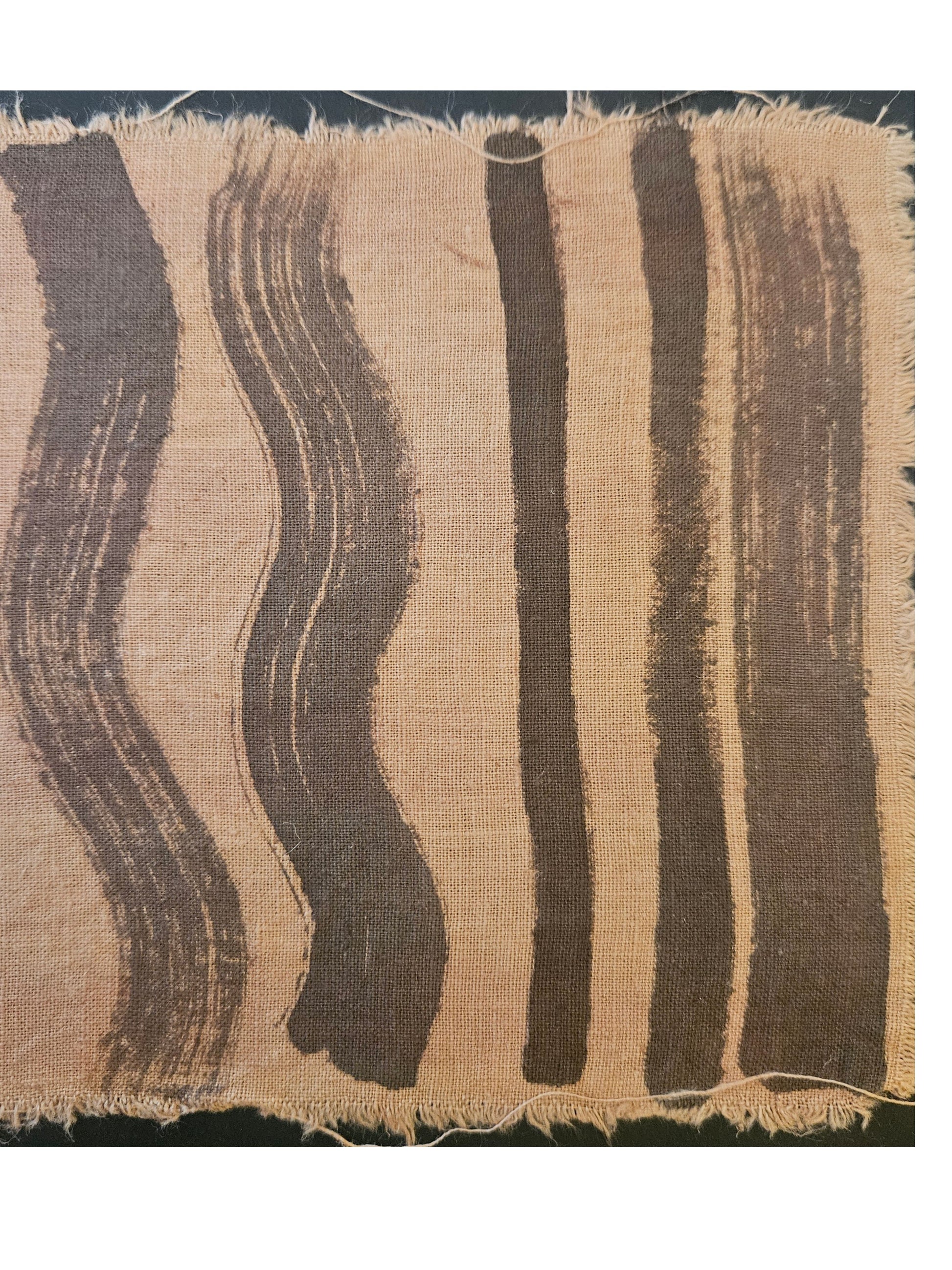 Textile sample with wavy brown stripes on a beige background